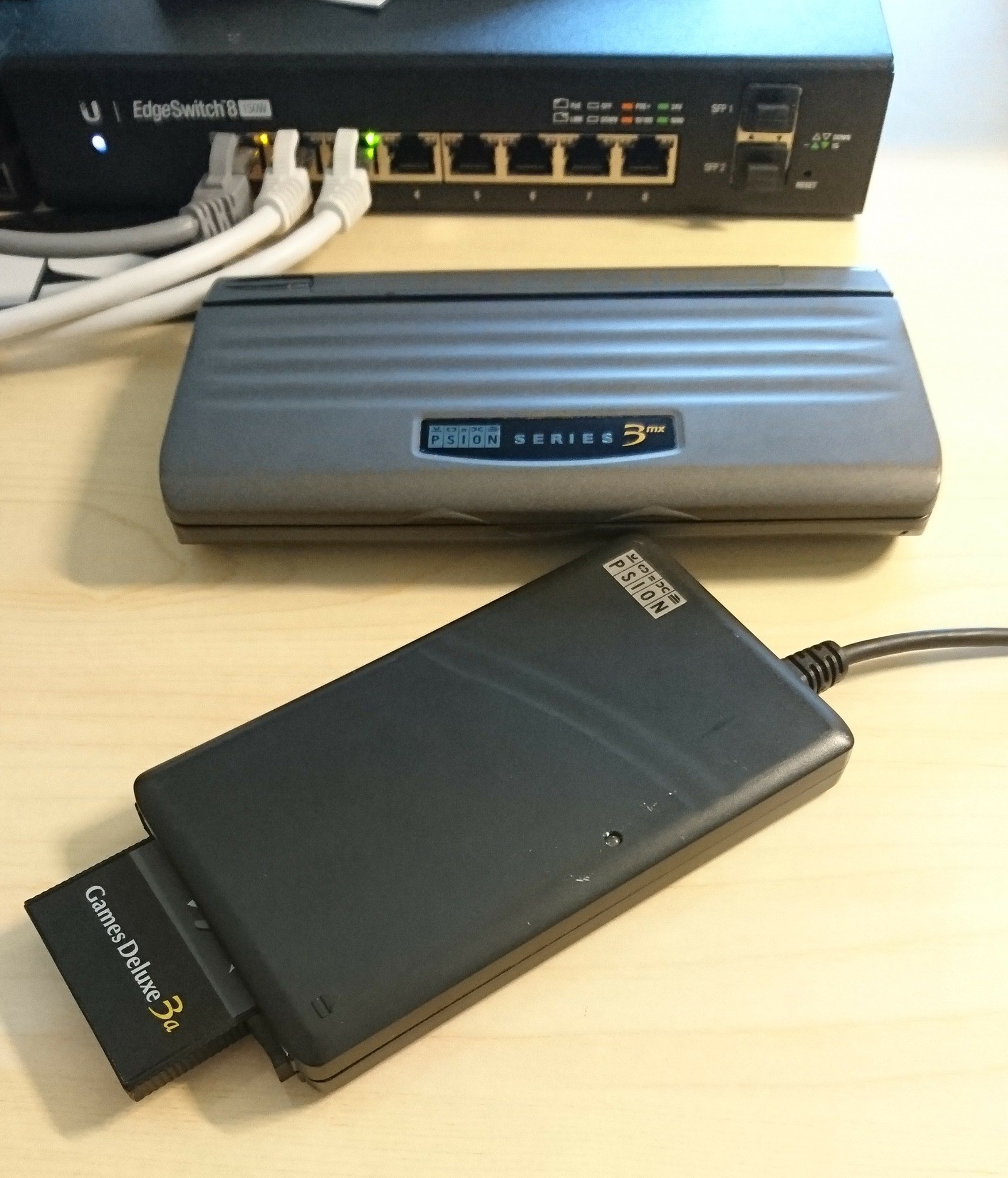 A Psion Series 3mx next to a Siena SSD Drive